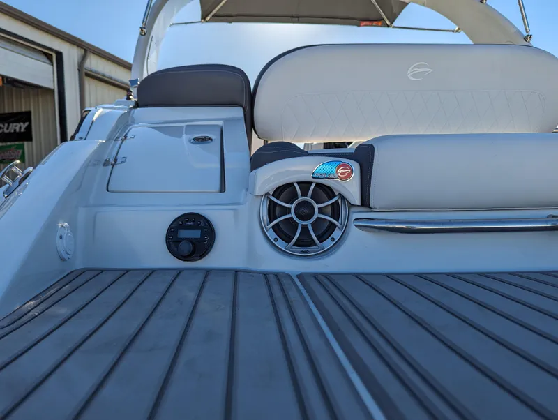 Slide: The Image of 2023 Crownline 260 SS boat interior with sleek seating and modern speaker system. - 44