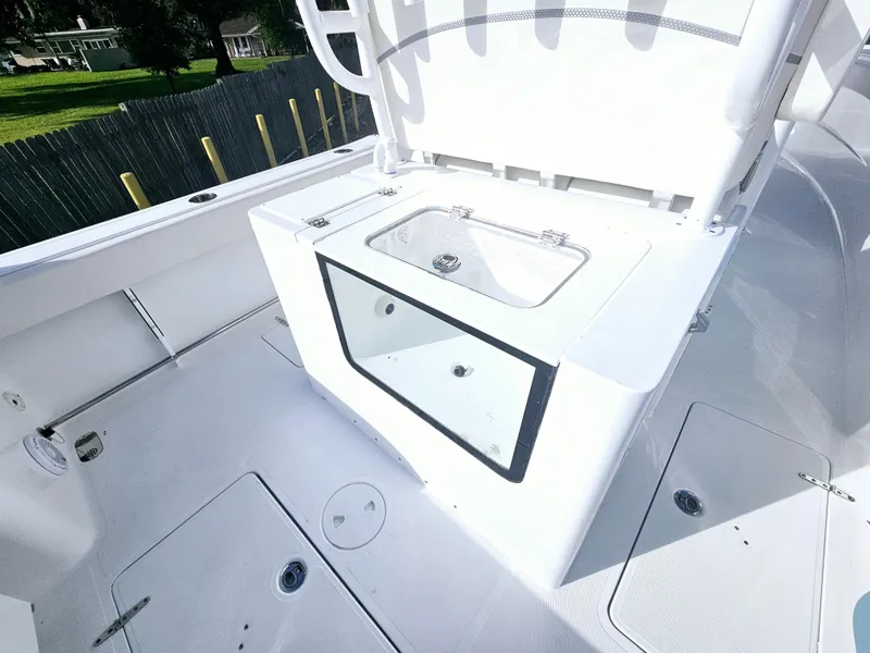Slide: The Image of 2025 Sea Hunt Gamefish 28 CB boat interior with storage compartment. - 16