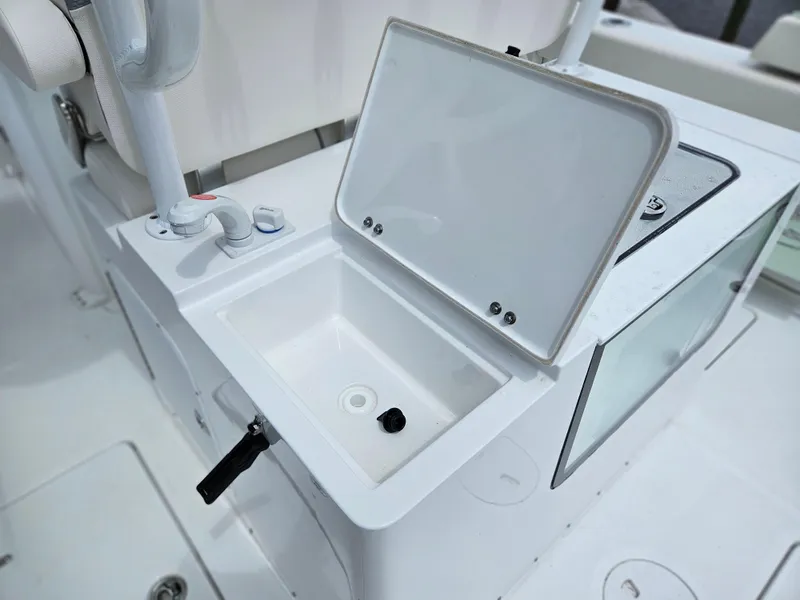 Slide: The Image of Open storage compartment on 2025 Sea Hunt Gamefish 28 CB boat. - 17
