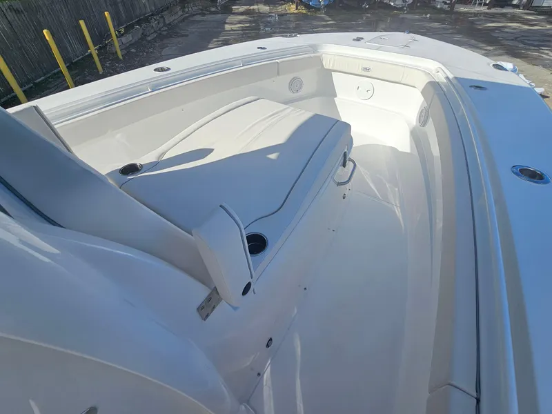 Slide: The Image of 2025 Sea Hunt Gamefish 28 CB boat interior with seating and cup holders. - 24