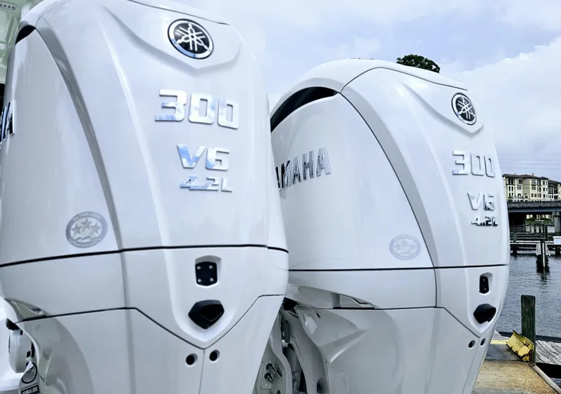 Slide: The Image of Twin Yamaha 300 V6 outboard engines on a 2025 Sea Hunt Gamefish 28 CB boat. - 3