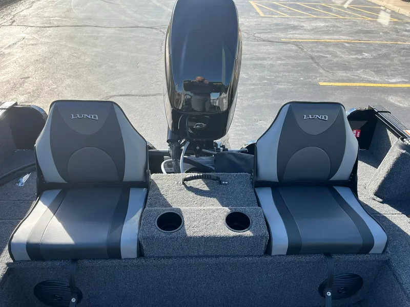 Slide: The Image of 2025 Lund 1650 Rebel XL SS boat interior with dual seats and motor. - 12