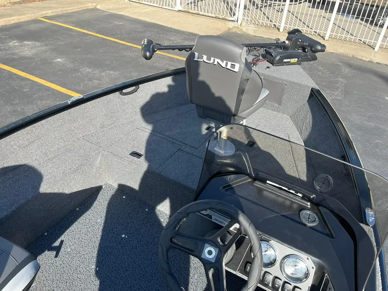 Slide: The Image of 2025 Lund 1650 Rebel XL SS boat interior with steering console and seating. - 14