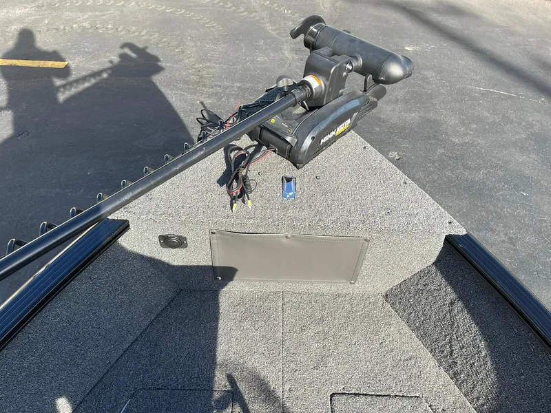 Slide: The Image of 2025 Lund 1650 Rebel XL SS boat with trolling motor on deck. - 17