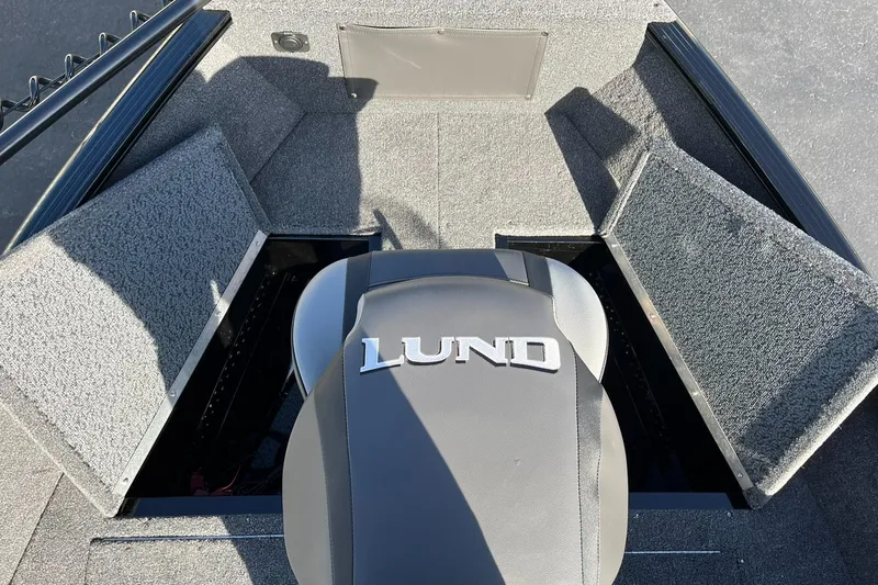 Slide: The Image of 2025 Lund 1650 Rebel XL SS boat interior with open storage compartments. - 19