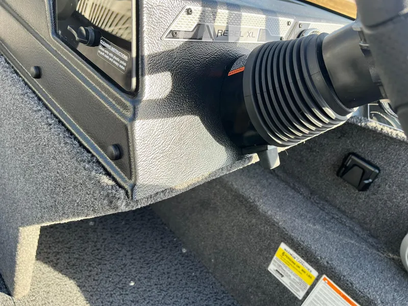 Slide: The Image of 2025 Lund 1650 Rebel XL SS dashboard detail with textured finish and control panel. - 22