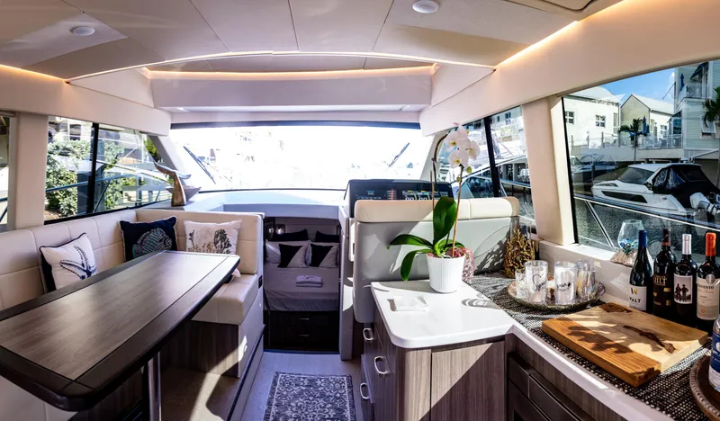 Slide: The Image of Luxurious interior of 2022 Regal 42 FXO yacht with elegant dining and kitchen area. - 16