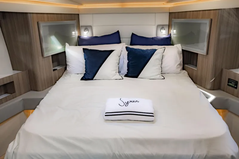 Slide: The Image of Luxurious bedroom interior of 2022 Regal 42 FXO yacht with elegant bedding. - 18