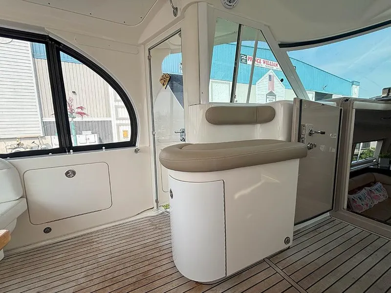 Slide: The Image of 2002 Sea Ray 480 Motor Yacht interior with seating and wood flooring. - 10