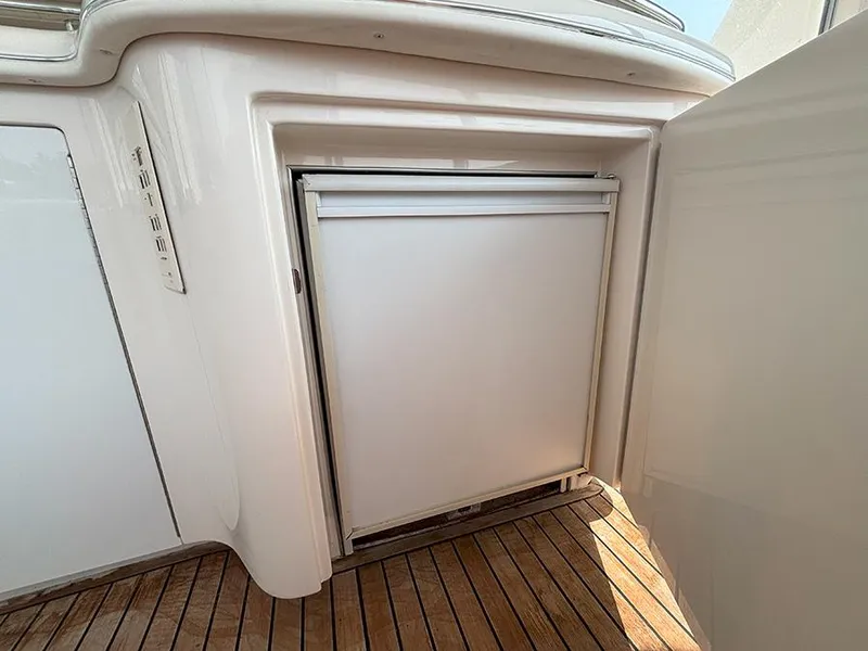 Slide: The Image of Built-in refrigerator on 2002 Sea Ray 480 Motor Yacht with teak flooring. - 12