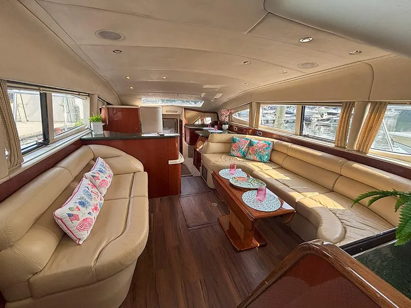 Slide: The Image of Luxurious interior of 2002 Sea Ray 480 Motor Yacht with plush seating and elegant decor. - 13