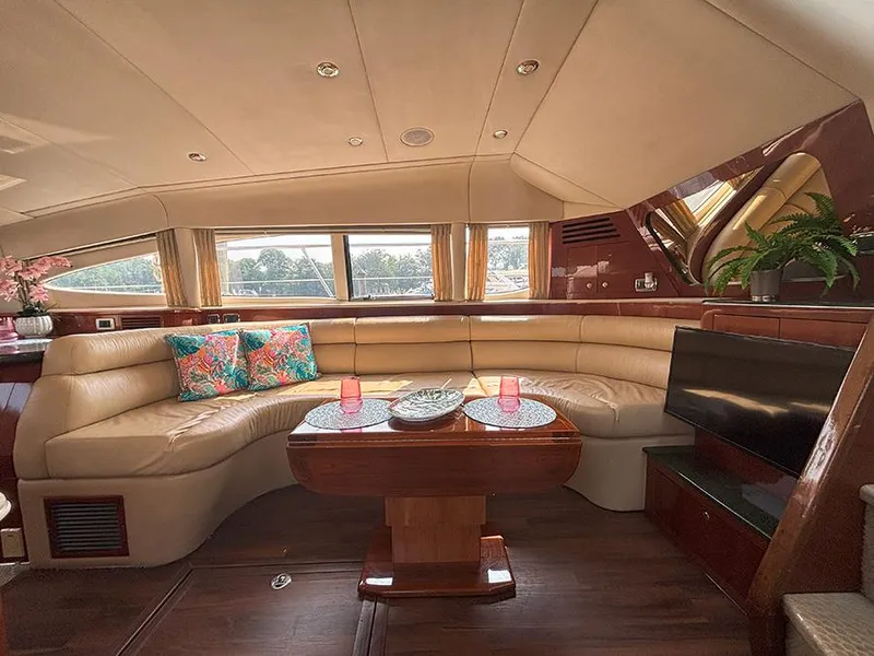 Slide: The Image of Luxurious interior of 2002 Sea Ray 480 Motor Yacht with plush seating and elegant decor. - 14