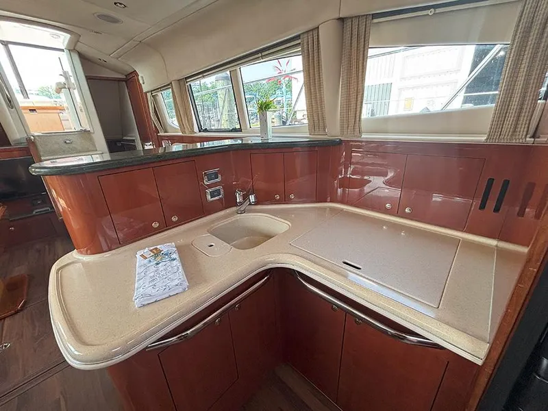 Slide: The Image of Luxurious kitchen area in a 2002 Sea Ray 480 Motor Yacht with sleek countertops. - 18