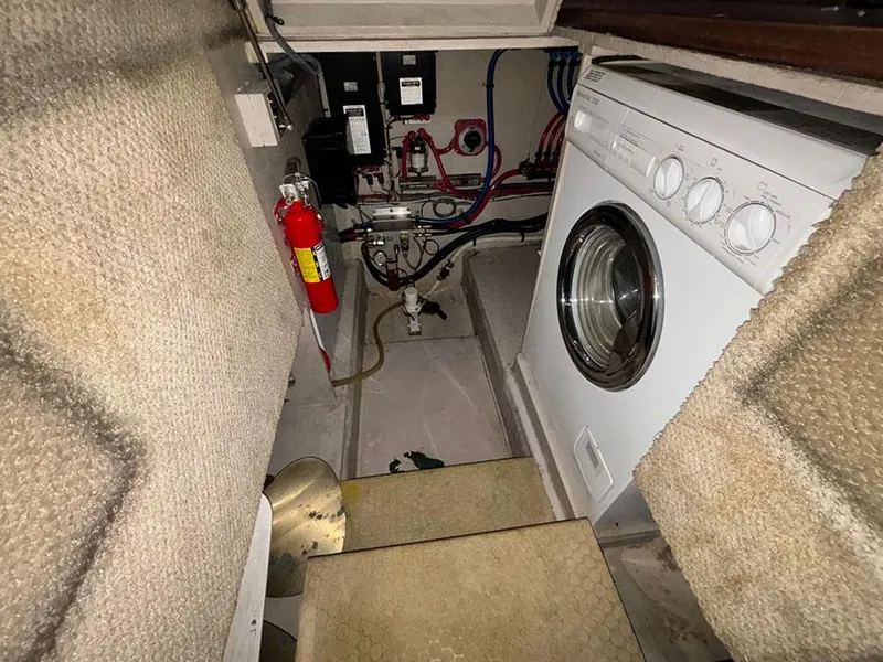 Slide: The Image of Laundry area in 2002 Sea Ray 480 Motor Yacht with washer and fire extinguisher. - 22