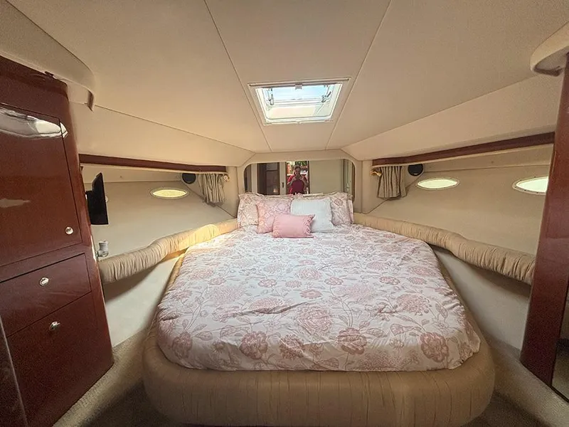 Slide: The Image of Luxurious bedroom interior of 2002 Sea Ray 480 Motor Yacht with skylight and elegant bedding. - 23