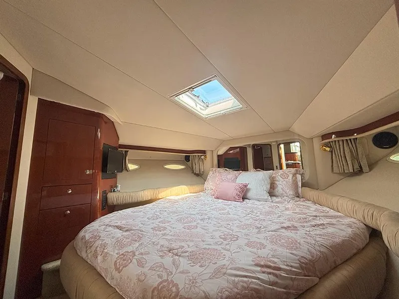 Slide: The Image of Luxurious bedroom interior of 2002 Sea Ray 480 Motor Yacht with skylight and elegant bedding. - 24