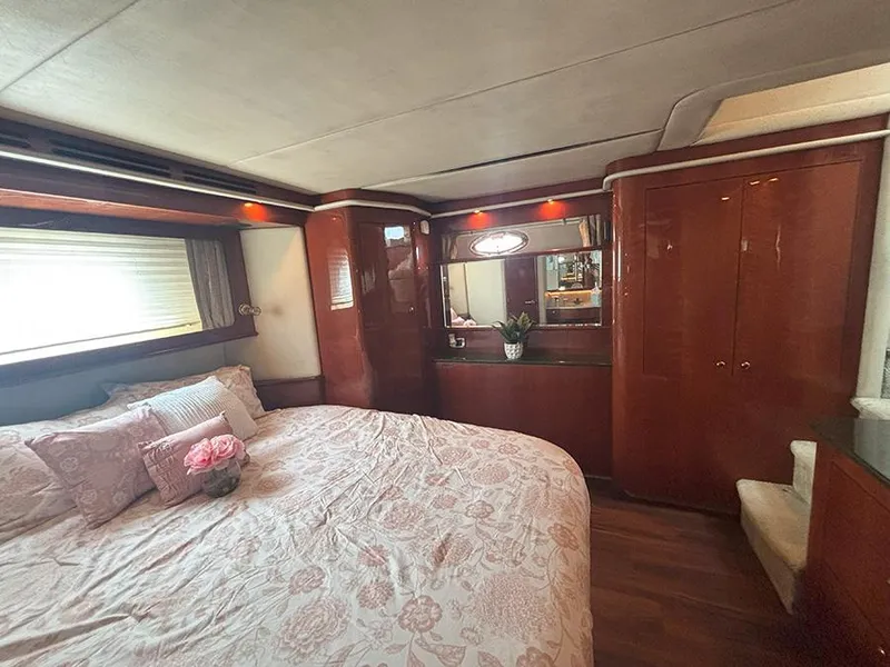 Slide: The Image of Luxurious bedroom interior of 2002 Sea Ray 480 Motor Yacht with elegant wood finish. - 35