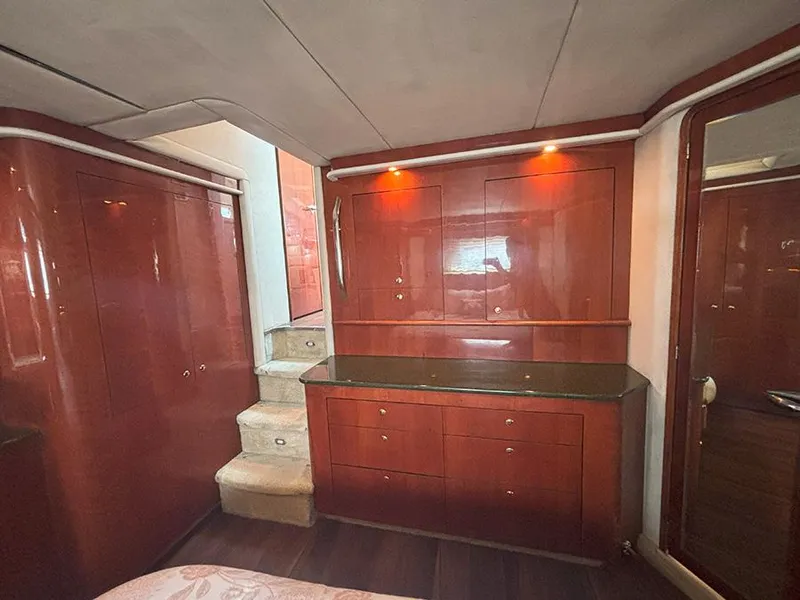 Slide: The Image of Luxurious interior of 2002 Sea Ray 480 Motor Yacht with wooden cabinetry and soft lighting. - 39