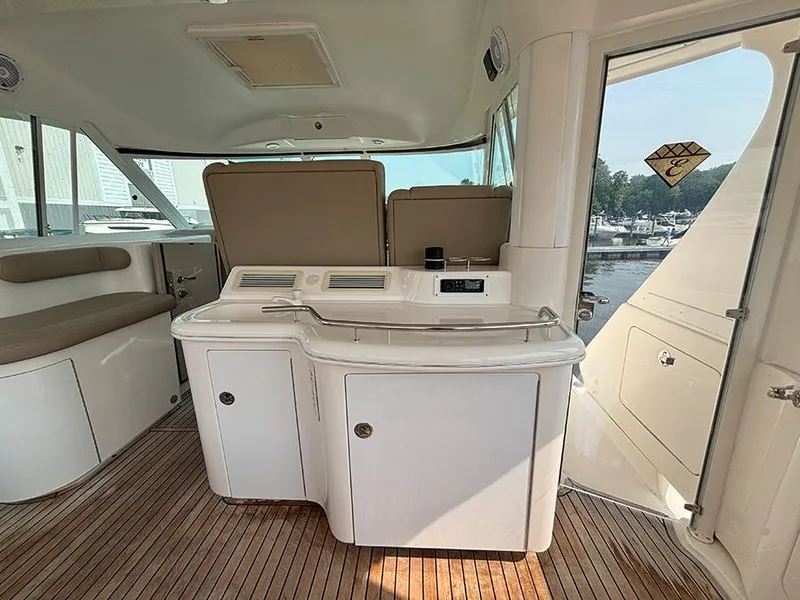 Slide: The Image of 2002 Sea Ray 480 Motor Yacht interior with sleek cabinetry and wood flooring. - 43
