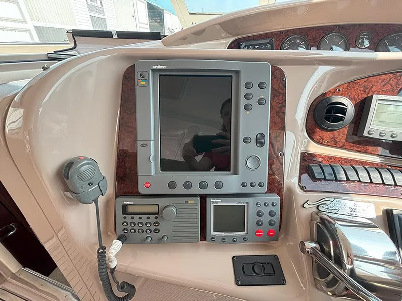 Slide: The Image of Control panel of a 2002 Sea Ray 480 Motor Yacht with navigation equipment. - 46