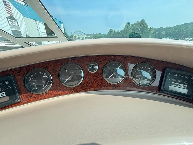 Slide: The Image of Dashboard of 2002 Sea Ray 480 Motor Yacht with gauges and Caterpillar display. - 48