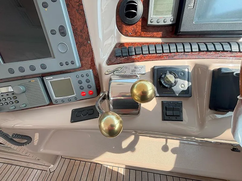 Slide: The Image of Control panel of a 2002 Sea Ray 480 Motor Yacht with navigation instruments. - 7