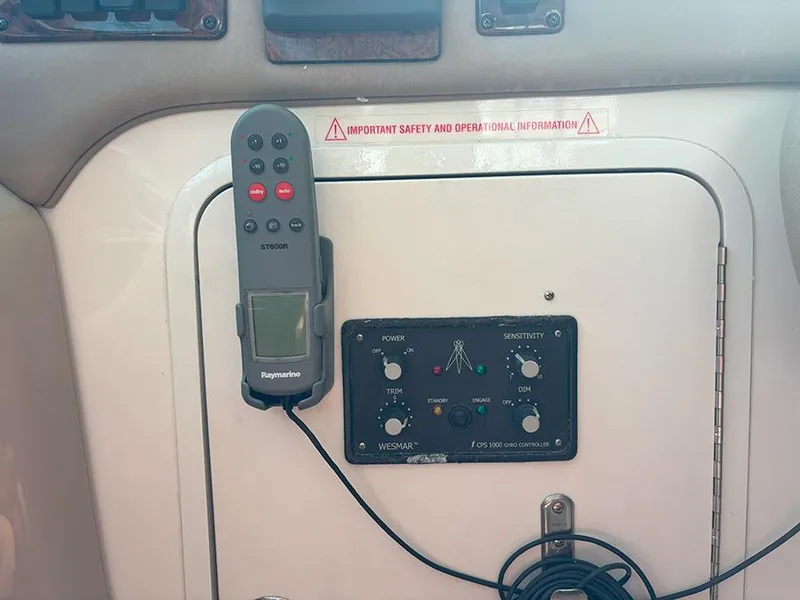 Slide: The Image of Control panel of a 2002 Sea Ray 480 Motor Yacht with remote and safety information. - 8
