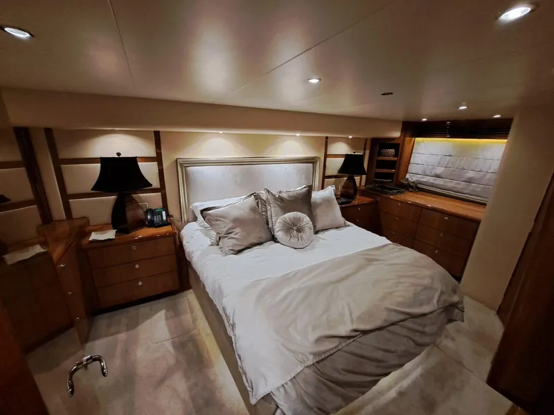 Slide: The Image of Luxurious bedroom interior of 2006 Hatteras 68 Convertible yacht with elegant decor. - 23