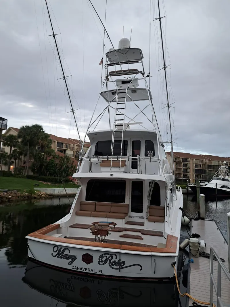 Slide: The Image of 2006 Hatteras 68 Convertible yacht docked at marina, rear view. - 48