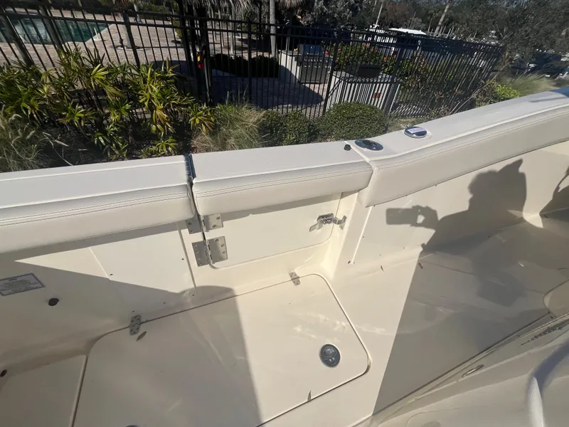 Slide: The Image of 2025 Scout 277 LXF boat interior with seating and storage compartments. - 7