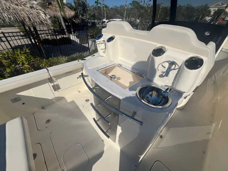 Slide: The Image of 2025 Scout 277 LXF boat interior with sink and storage area. - 9