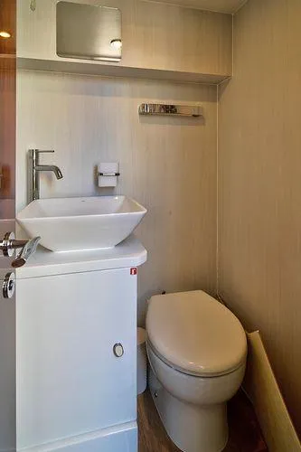 Slide: The Image of Modern bathroom in 2021 Fairline Squadron 68 yacht with sink and toilet. - 10
