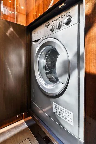 Slide: The Image of Washing machine inside 2021 Fairline Squadron 68 yacht's wooden cabinet. - 13