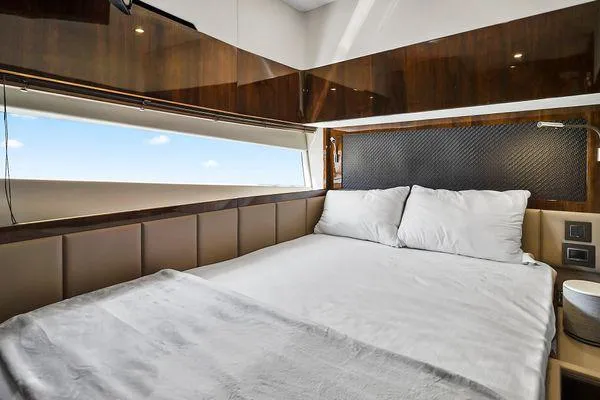 Slide: The Image of Luxurious bedroom interior of 2021 Fairline Squadron 68 yacht with elegant wood finishes. - 15