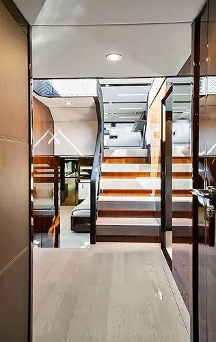 Slide: The Image of Interior of 2021 Fairline Squadron 68 yacht, featuring modern staircase and sleek design. - 18