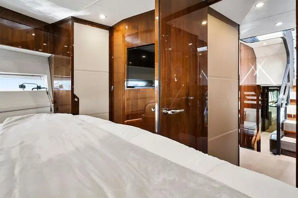 Slide: The Image of Luxurious interior of 2021 Fairline Squadron 68 yacht cabin with wood finishes. - 19