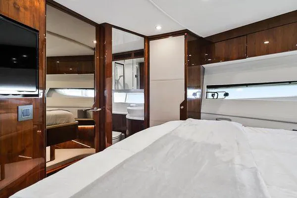 Slide: The Image of Luxurious interior of 2021 Fairline Squadron 68 yacht bedroom with wood finishes. - 20