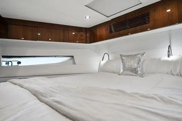 Slide: The Image of Luxurious bedroom interior of 2021 Fairline Squadron 68 yacht with elegant wood accents. - 21