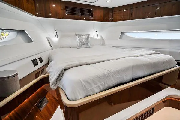 Slide: The Image of Luxurious bedroom interior of 2021 Fairline Squadron 68 yacht with elegant wood finishes. - 22