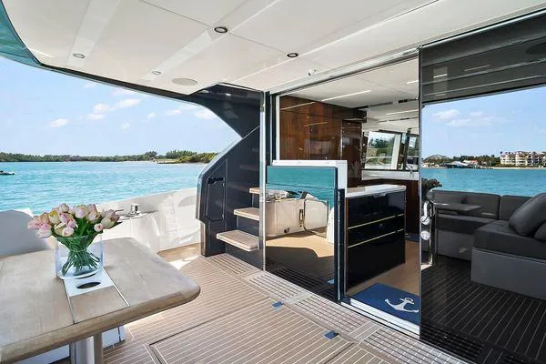 Slide: The Image of Luxurious 2021 Fairline Squadron 68 yacht interior with ocean view and elegant furnishings. - 45