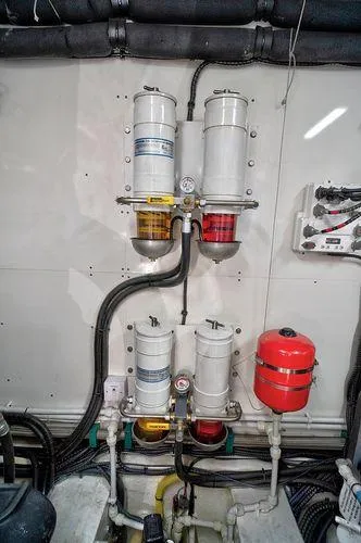 Slide: The Image of Engine room of 2021 Fairline Squadron 68 yacht with fuel filters and piping. - 5