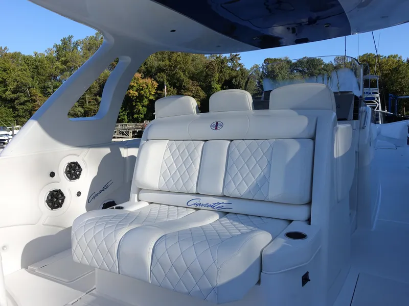 Slide: The Image of 2014 Cigarette 42 Huntress boat with luxurious white seating and sleek design. - 12