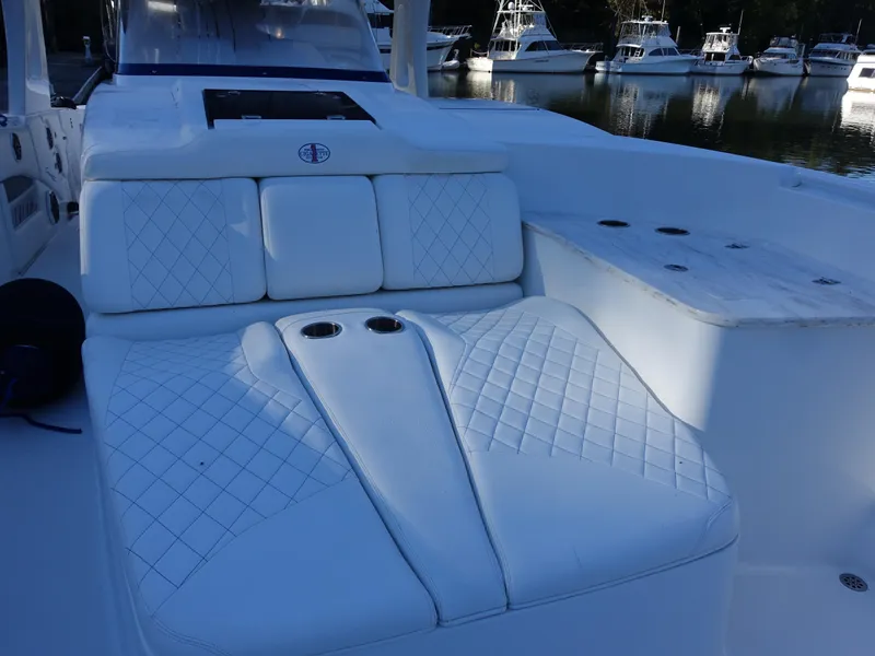 Slide: The Image of 2014 Cigarette 42 Huntress boat interior with white quilted seating. - 13