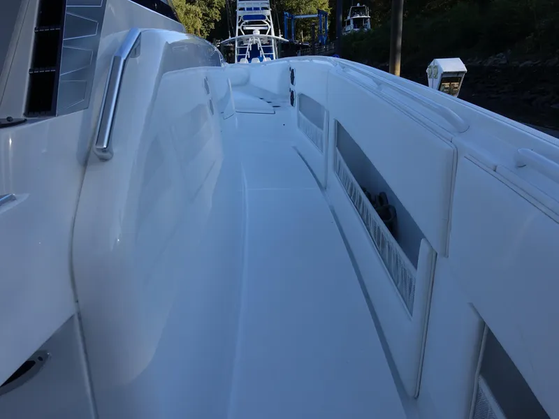 Slide: The Image of 2014 Cigarette 42 Huntress boat deck with sleek white design. - 15
