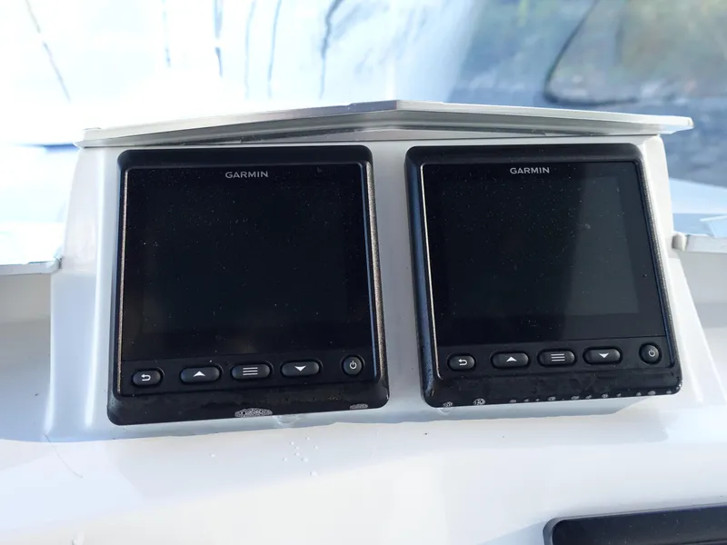 Slide: The Image of Garmin navigation displays on 2014 Cigarette 42 Huntress boat dashboard. - 17