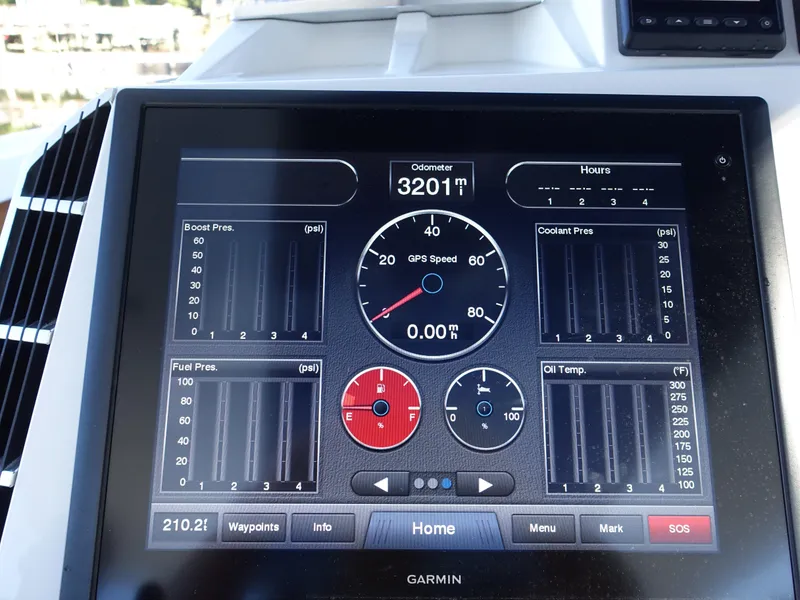 Slide: The Image of Garmin display on 2014 Cigarette 42 Huntress showing speed, odometer, and engine metrics. - 20