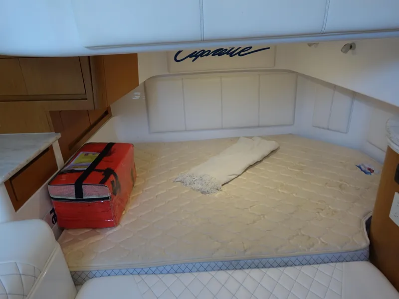 Slide: The Image of Interior cabin of 2014 Cigarette 42 Huntress with bed and storage. - 25