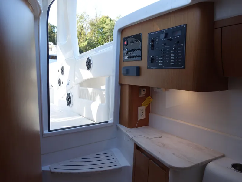 Slide: The Image of Interior of 2014 Cigarette 42 Huntress boat with control panel and seating area. - 27