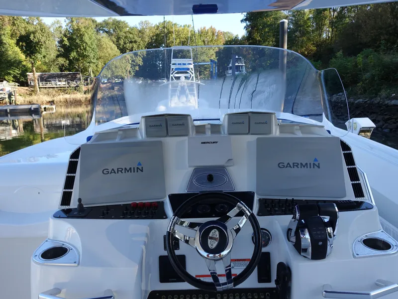 Slide: The Image of 2014 Cigarette 42 Huntress boat dashboard with Garmin navigation system. - 7