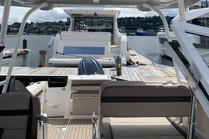 Slide: The Image of 2022 Cutwater C-24 DC boat docked at marina with scenic waterfront view. - 11